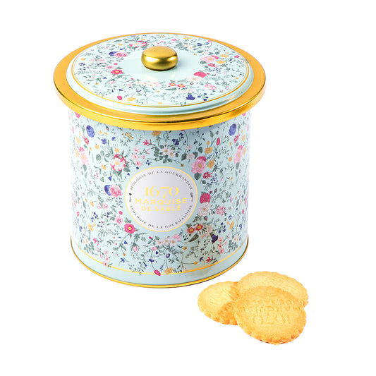 Decorative cookie tin with floral pattern and gold lid, accompanied by cookies on a white background , Bouquet Sauvage Tin – Butter & Chocolate Sablés – Maison Holder