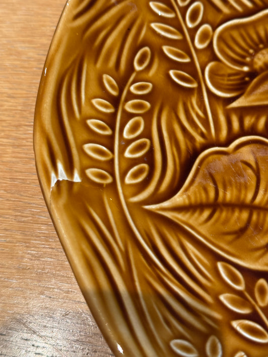 Brown ceramic plate with leaf patterns on a wooden surface, Sarreguemine Charger Plate – Mid-Century French Ceramic – Maison Holder