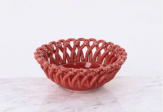 Decorative red ceramic bowl on a white marble surface, Iconic Bread Basket – Maison Pichon