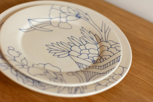 Set of white plates with blue floral patterns on a wooden surface, Deep Dish Rouen Decor – Desvres Earthenware – Maison Holder