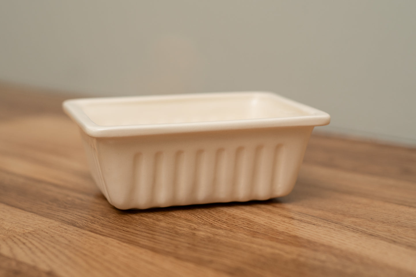 Beige ceramic dish on a wooden surface with a neutral background, Medium French Fries Tray – Desvres Earthenware – Maison Holder