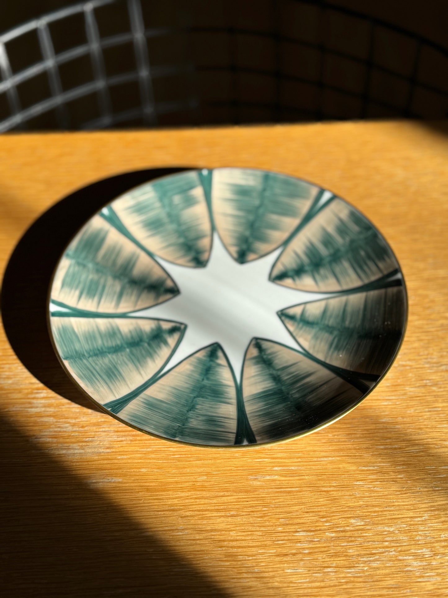 Decorative glass plate with star design on a wooden surface, Agave Hand-Painted Dessert Plate – Porcelain – Marie Daâge