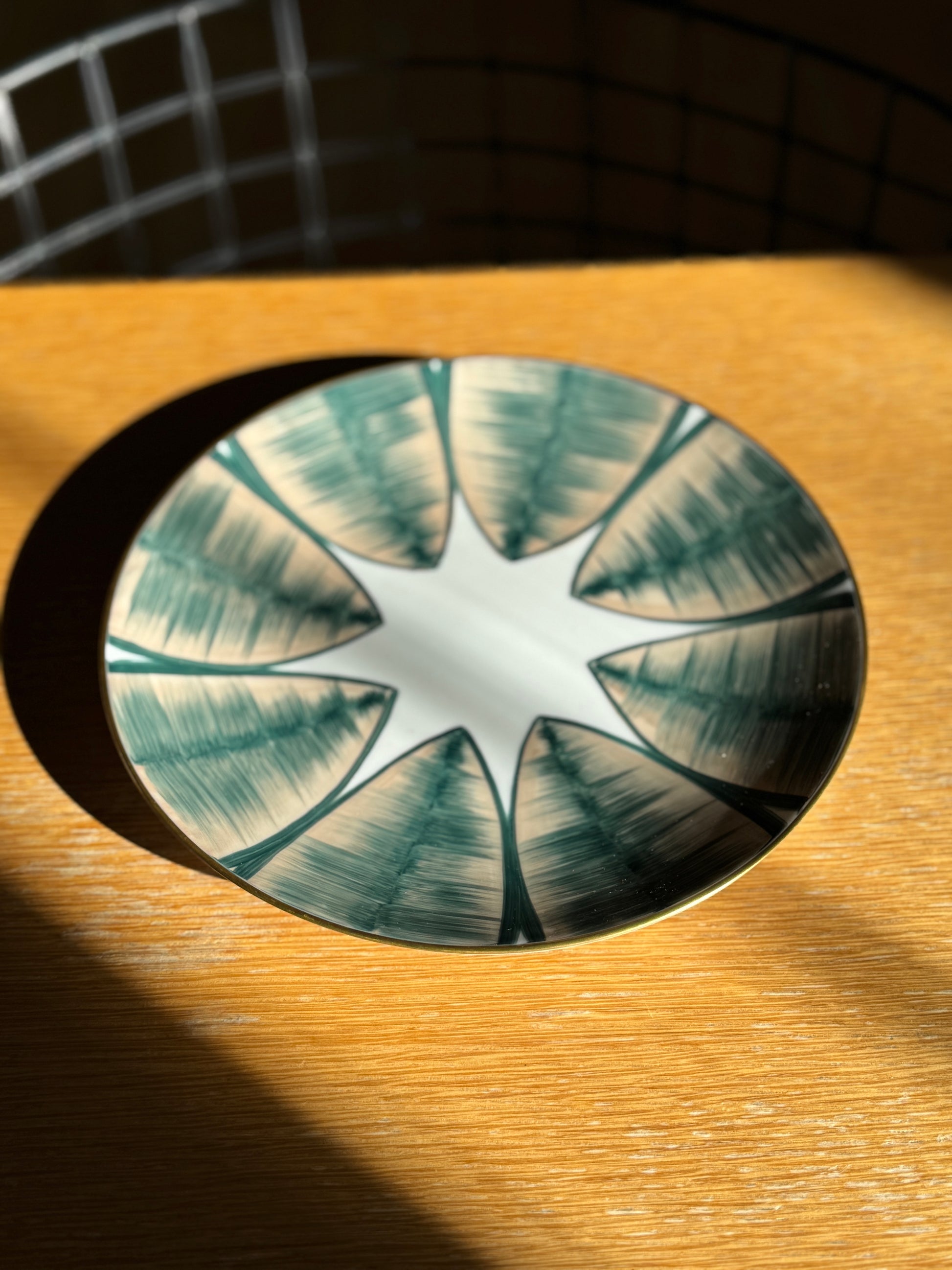 Decorative glass plate with star design on a wooden surface, Agave Hand-Painted Dessert Plate – Porcelain – Marie Daâge