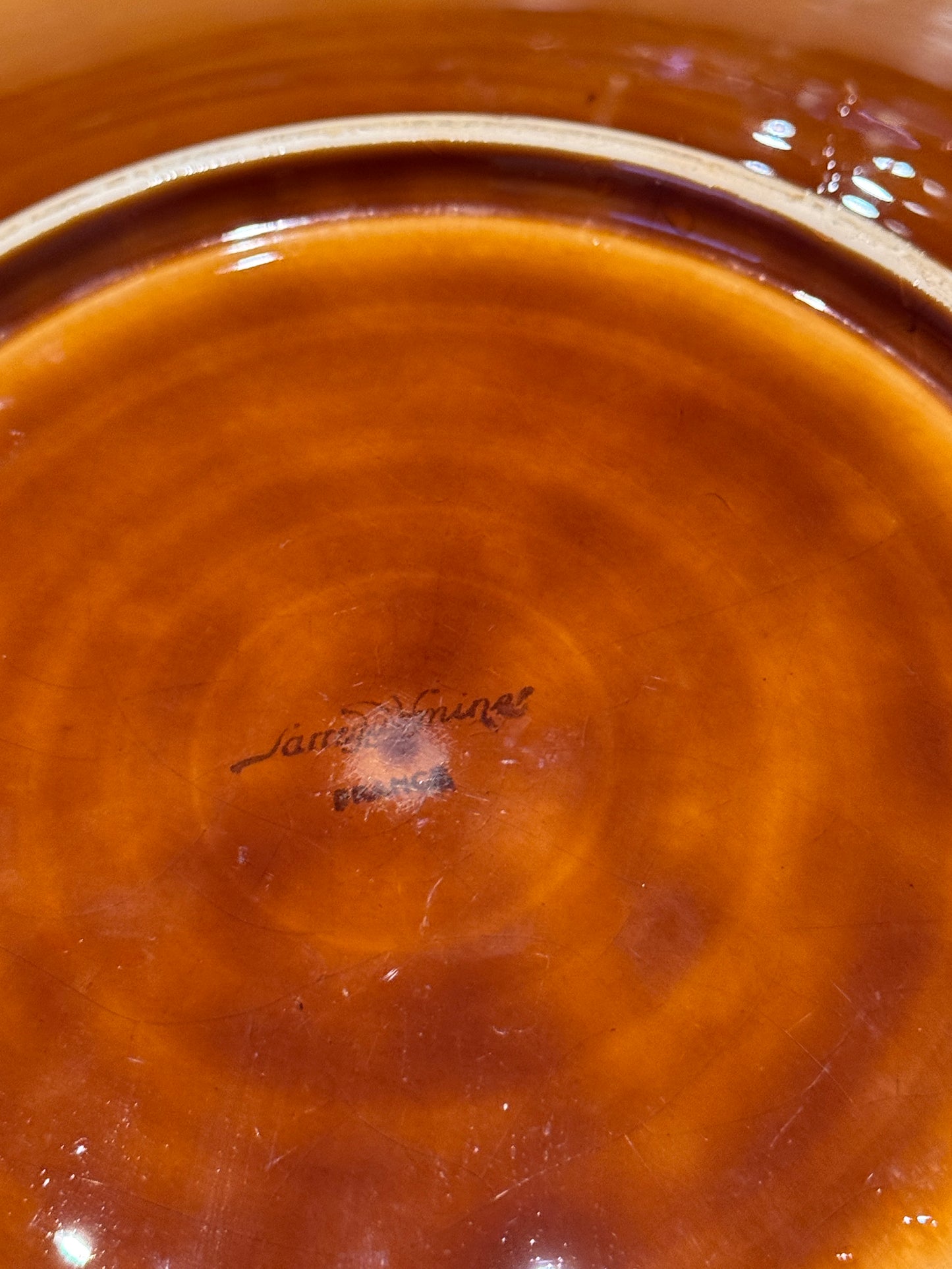 Close-up of a brown ceramic bowl with a visible brand logo, Sarreguemine Charger Plate – Mid-Century French Ceramic – Maison Holder