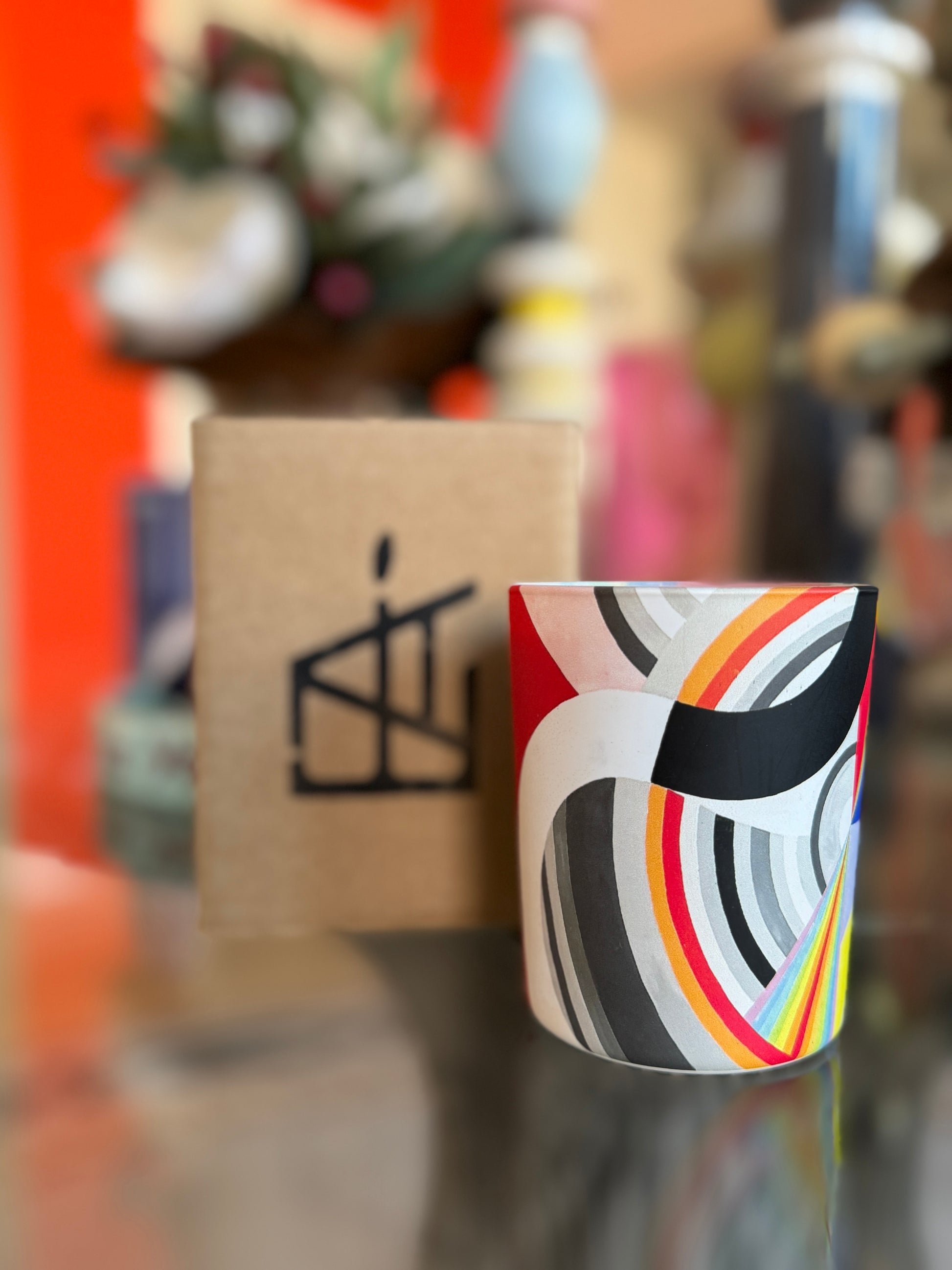 Decorative bottle with colorful label against a blurred background, Robert Delaunay Candle – Épreuve d’Artistes – Maison Holder