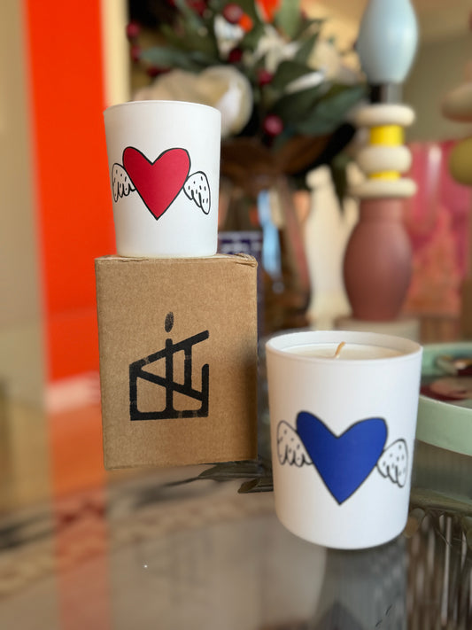 Two white cups with heart designs on a surface with a blurred background ,Jean-Charles de Castelbajac Art Candle – Épreuve d’Artistes – Maison Holder