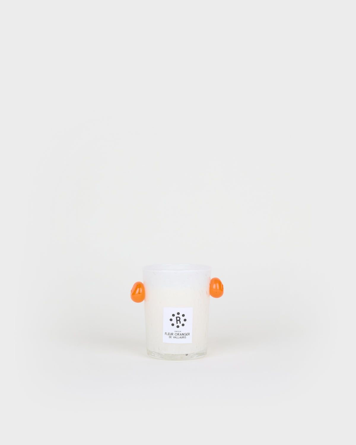 White candle with orange wick on a white background, Peony Candle Orange Blossom – La Romaine Editions – Maison Holder