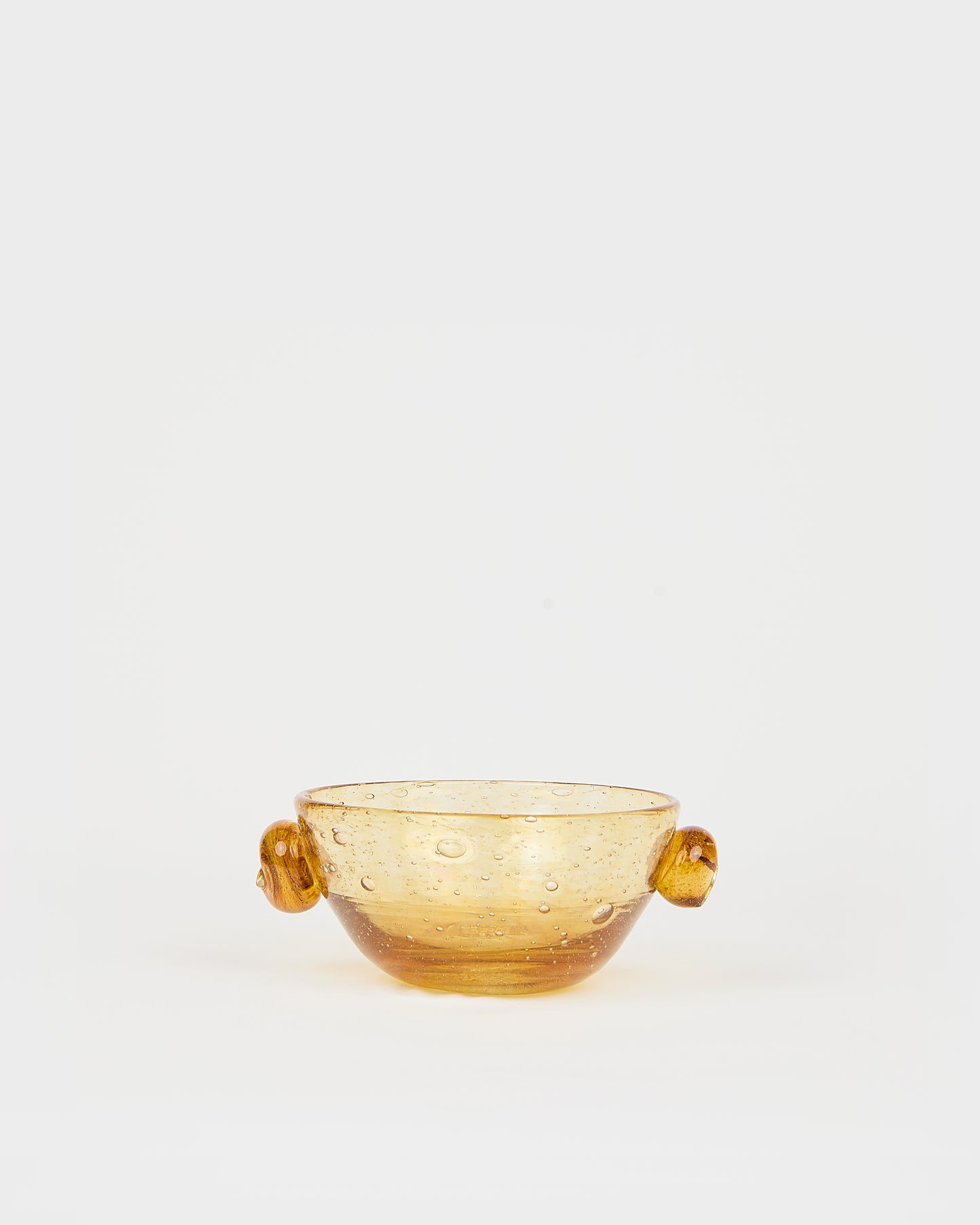 Amber glass bowl with handles on a white background, Poppy Cup – La Romaine Editions Bubble Glass – Maison Holder