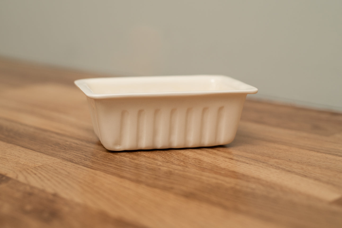 Rectangular white ceramic dish on a wooden surface with a neutral background, Small French Fries Tray – Desvres Earthenware – Maison Holder