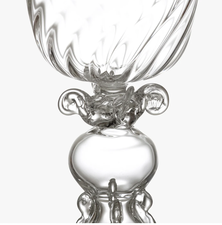 Close-up of a clear glass object with intricate design on a white background. Jean Boggio Tentations Wine Glass – WAWW – Maison Holder