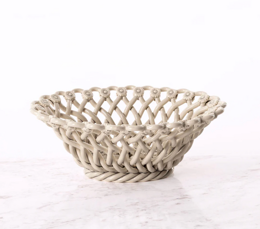 Woven basket on a white marble surface,Lisa Iconic Basket – Handmade Ceramic – Maison Pichon