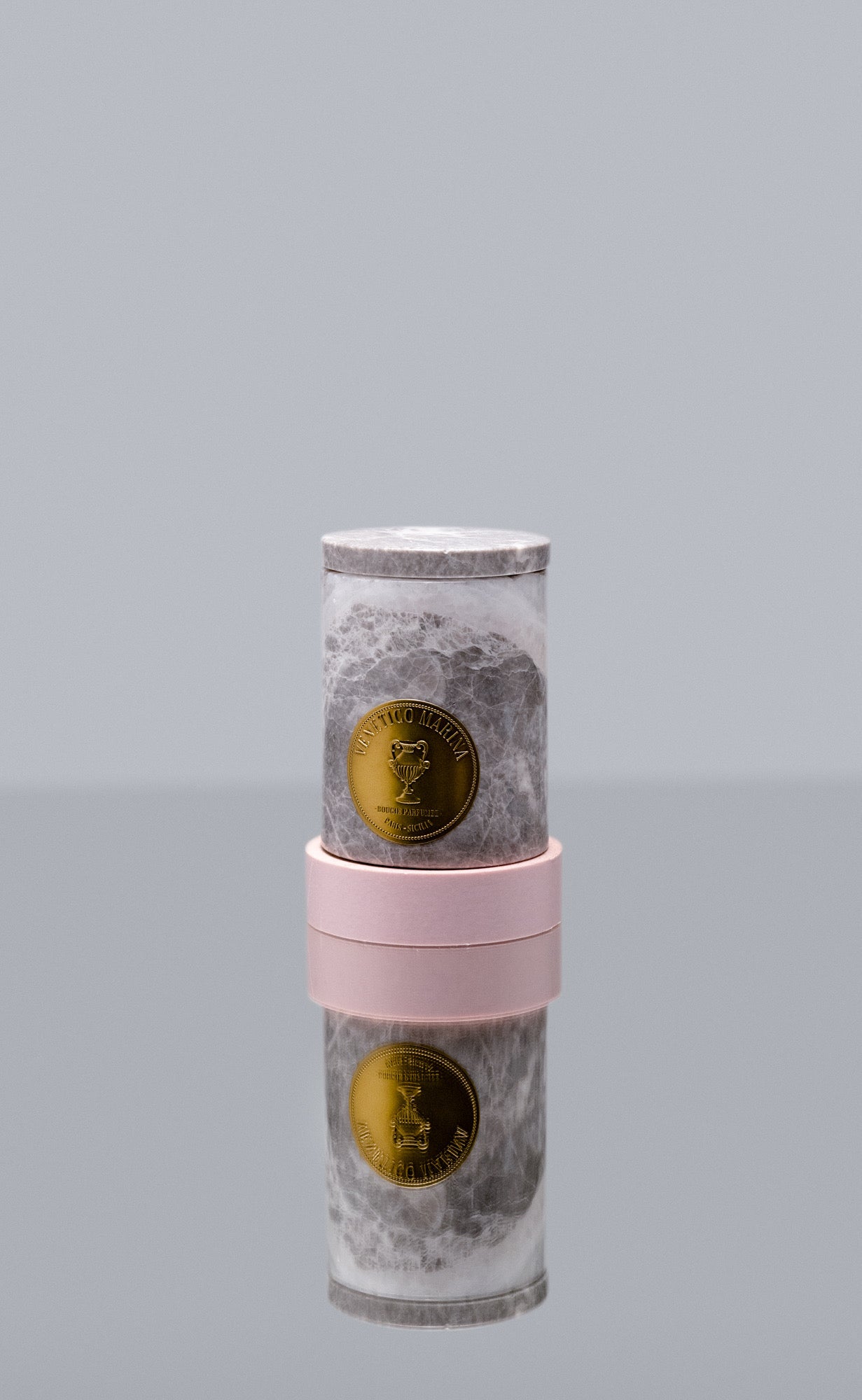 Cylindrical container with marble-like design and pink accents on a gray background, Salina Marble Candle – Maison Holder Luxury Scented Marble