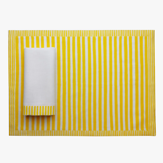 Yellow and white striped placemat with a folded white napkin on a white background, Milleraies Striped Linen Placemat – Aurelie Bidermann – Maison Holder