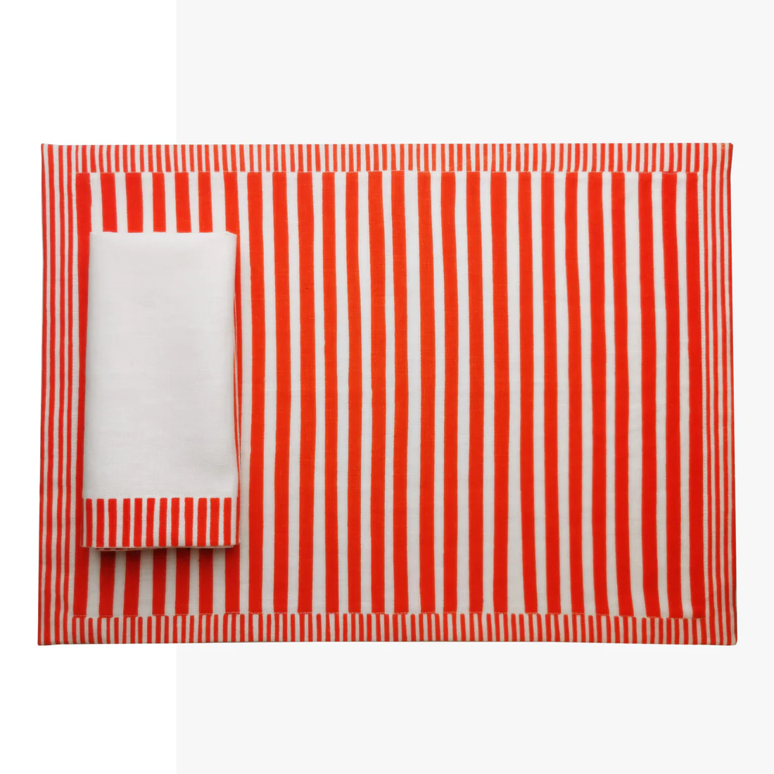 Red and white striped tablecloth with a folded corner on a white background, Milleraies Striped Linen Placemat – Aurelie Bidermann – Maison Holder