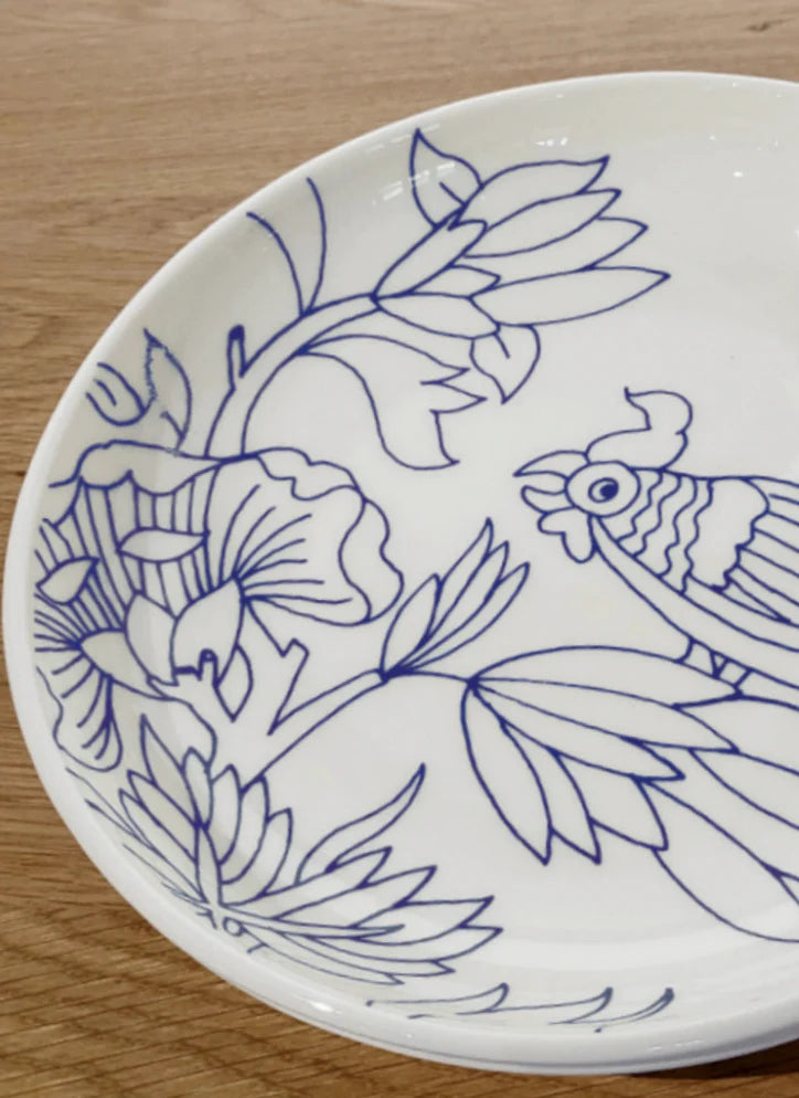 White plate with blue floral and rooster design on a wooden surface, Deep Dish Rouen Decor – Desvres Earthenware – Maison Holder