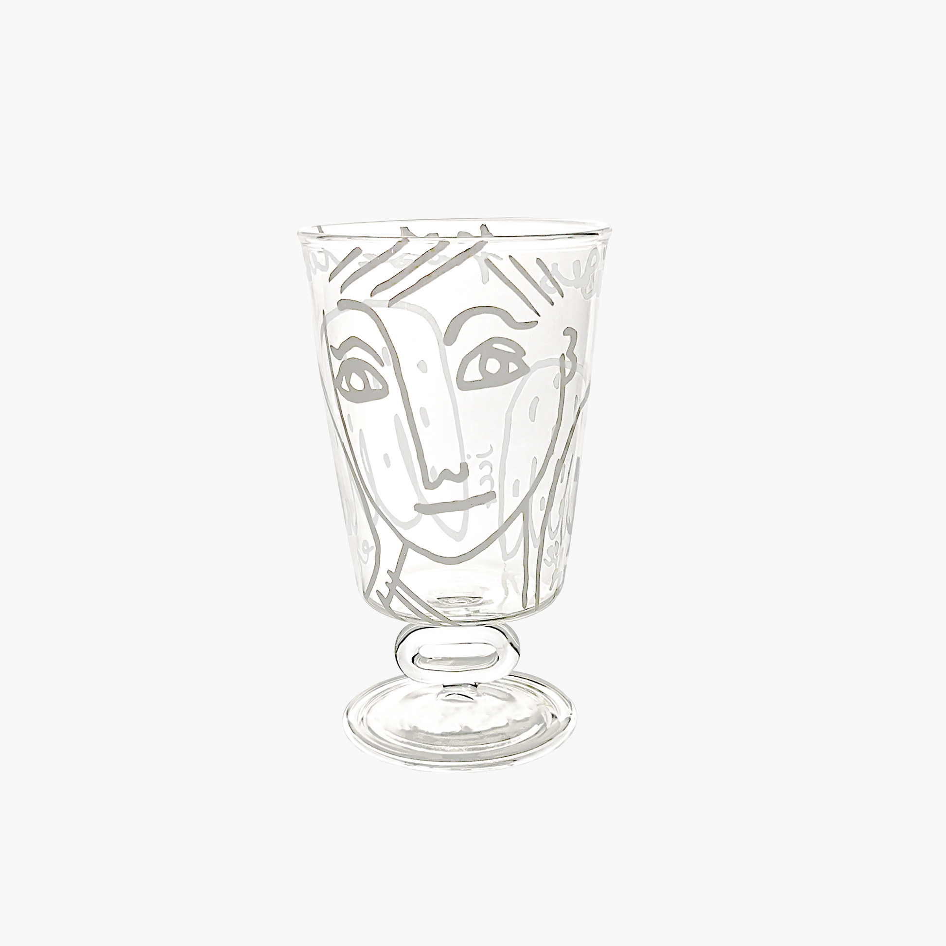 Clear glass with a face design on a white background, Jean-Charles de Castelbajac Angel Wine Glass – WAWW
