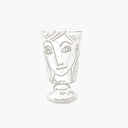 Clear glass with a face design on a white background, Jean-Charles de Castelbajac Angel Wine Glass – WAWW