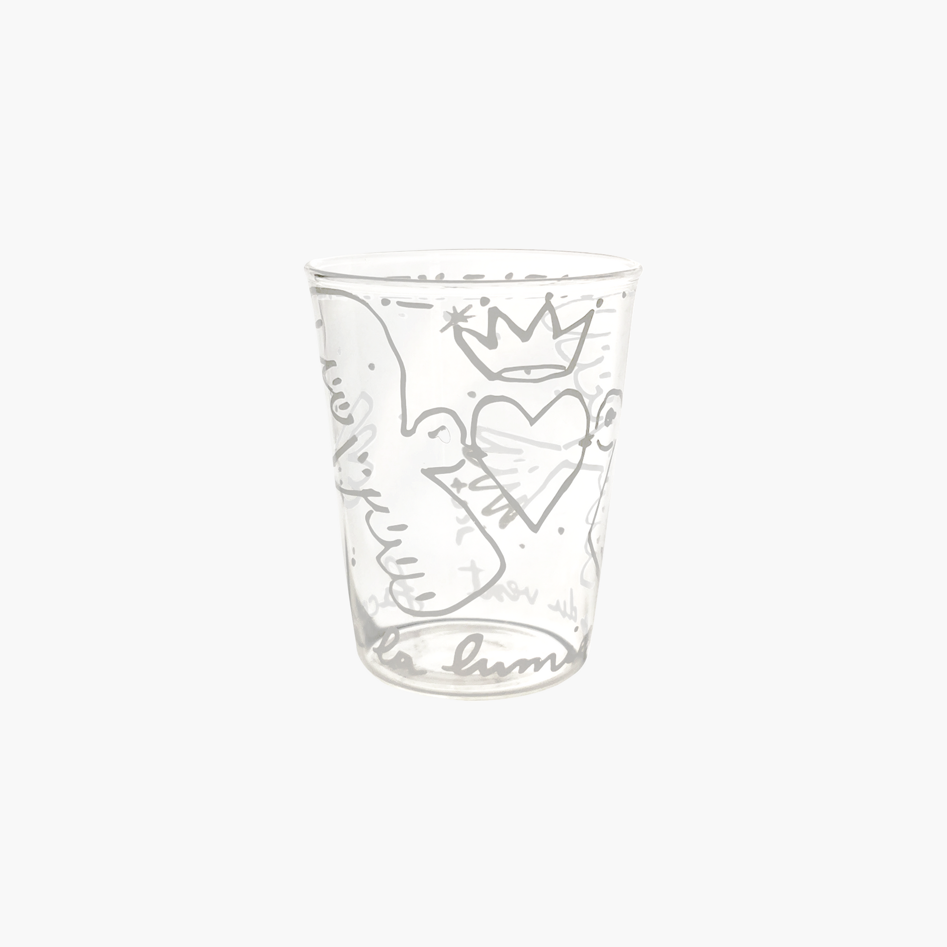 Clear glass tumbler with engraved designs on a white background , Jean-Charles de Castelbajac Colombes Tumbler – Hand-Blown Glass